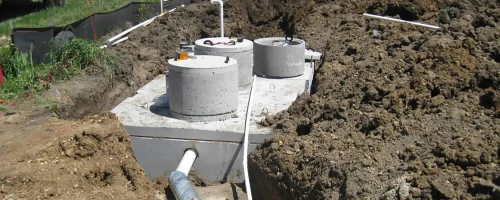 Septic system repair and installation site with tank access ports in Grand Rapids, MI